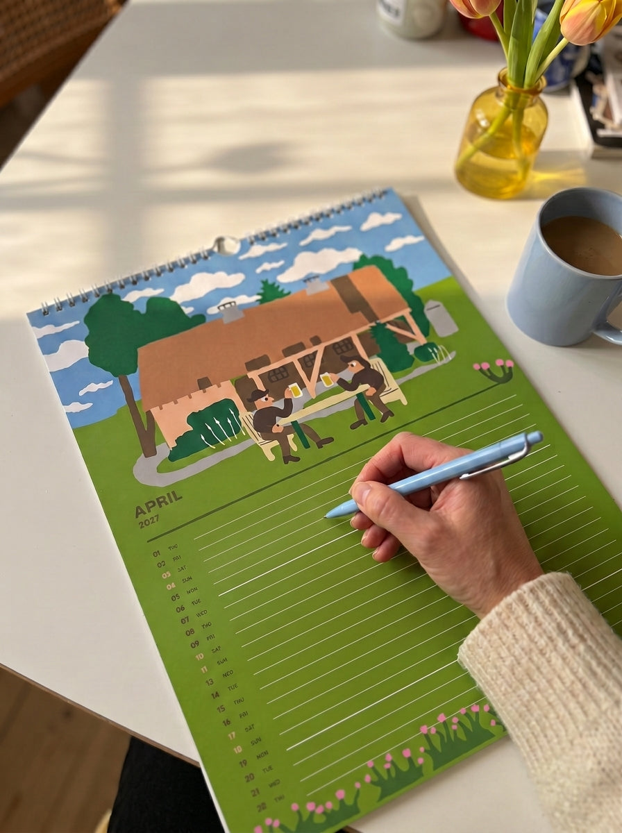 The April page of the Mikkeller Wall Calendar 2027 on a sunny table