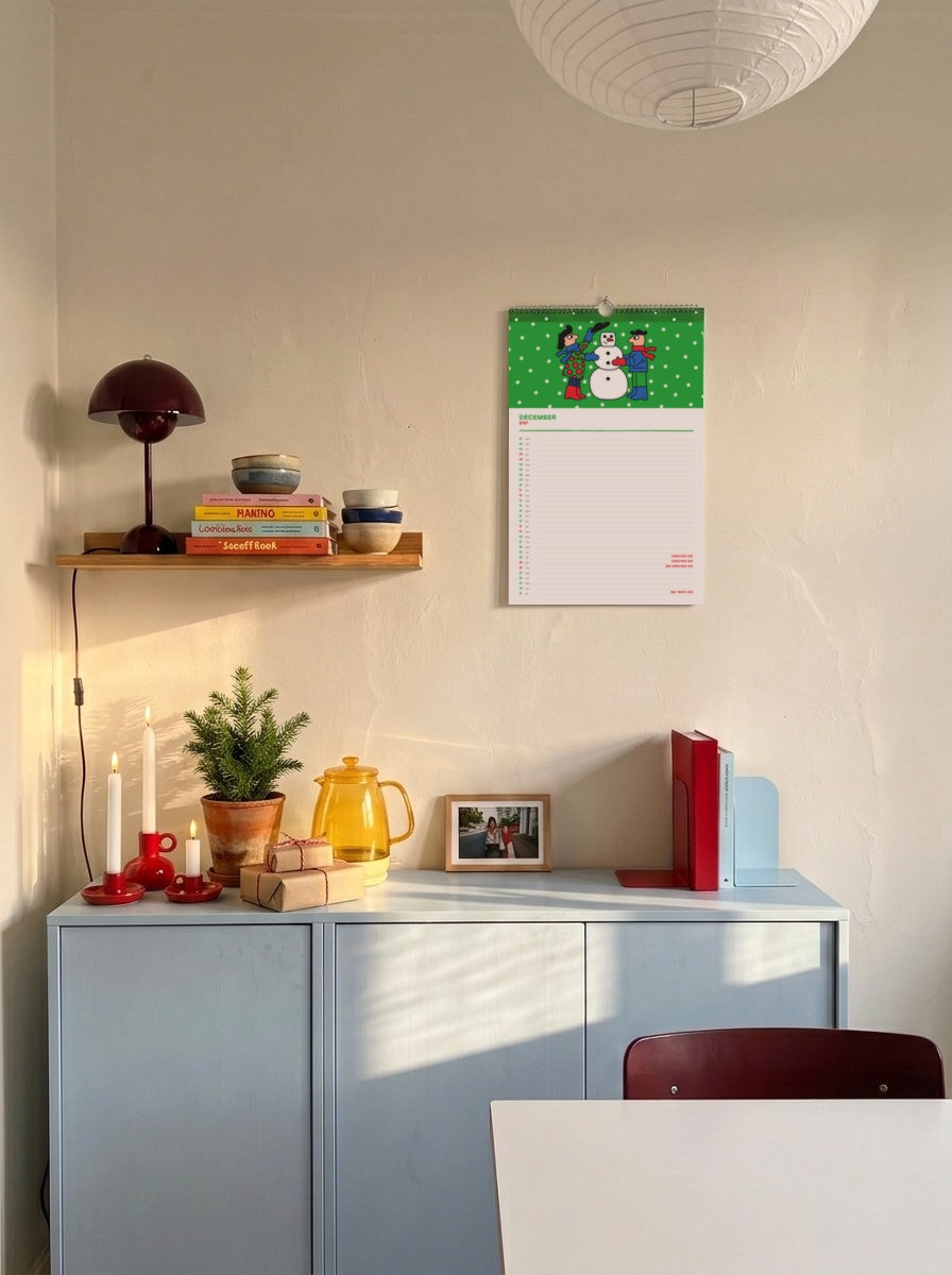 December page of the Mikkeller Wall Calendar 2027 in a cosy Christmas home
