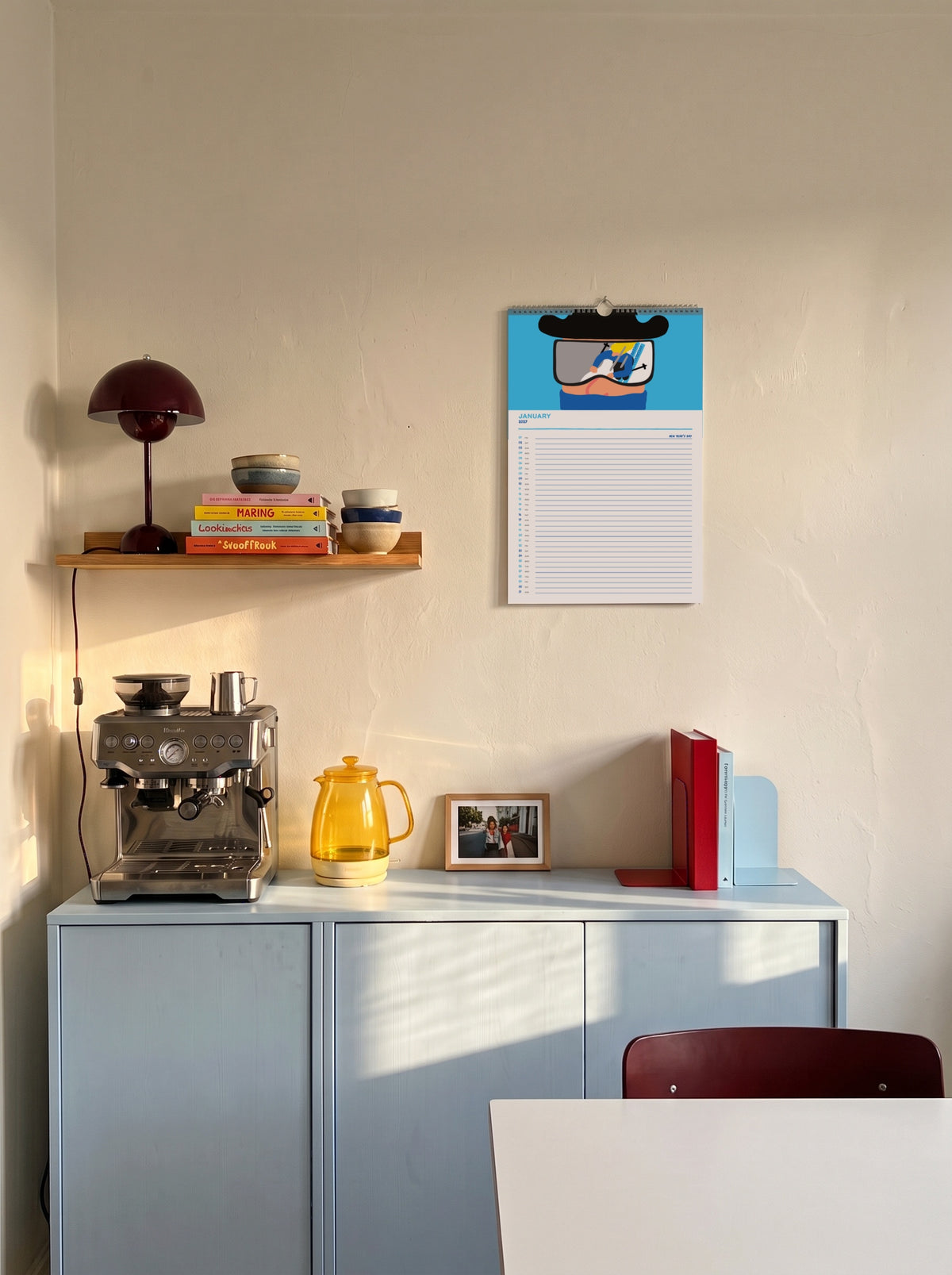 January page of the Mikkeller Wall Calendar 2027 above a sideboard